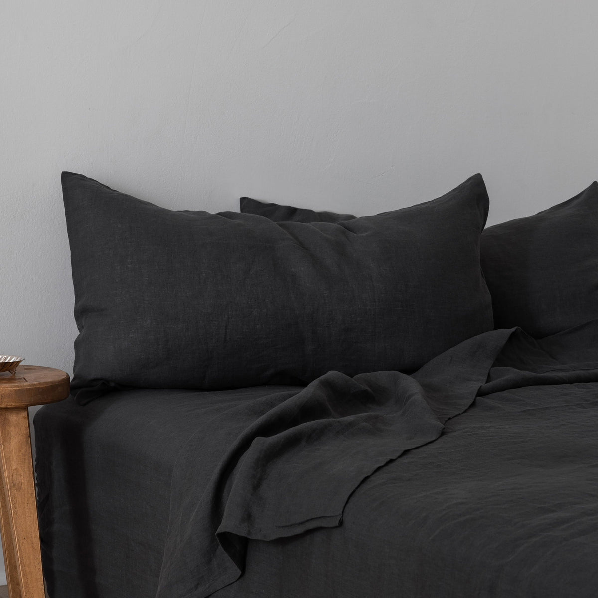 Sierra Dreams European linen sheet set in Slate, made on a bed
