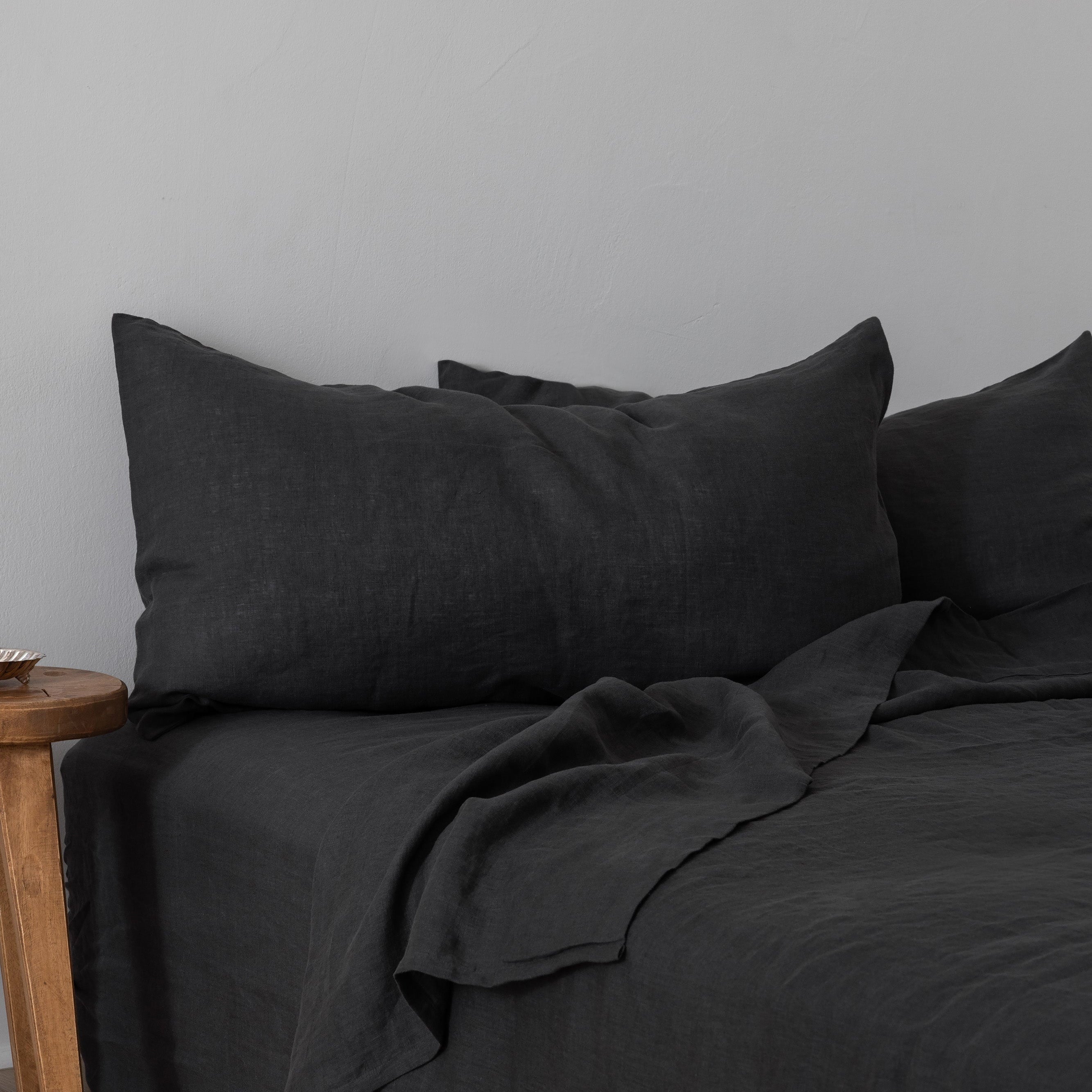 Sierra Dreams European linen sheet set in Slate, made on a bed